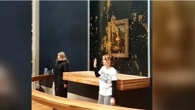 Các nhà hoạt động khí hậu ném súp vào tranh của Monet - Ảnh 1. Các nhà hoạt động khí hậu ném súp vào tranh của Monet - Ảnh 1.