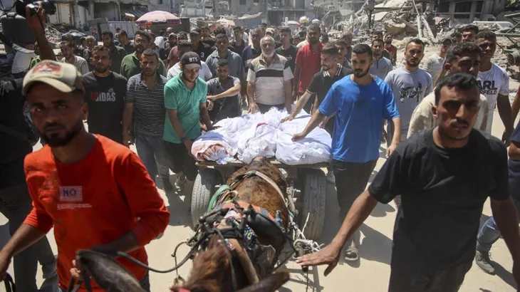 Israel lại tấn công thành phố Gaza, Văn phòng Hội chữ thập đỏ trúng đạn pháo - Ảnh 1. Israel lại tấn công thành phố Gaza, Văn phòng Hội chữ thập đỏ trúng đạn pháo - Ảnh 1.