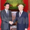 Party leader receives Lao diplomat