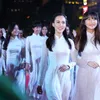 HCMC charms tourists with ao dai show on walking street