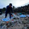 Collecting trash on Tri Nguyen Island