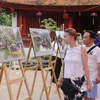 Photo exhibition celebrates Hanoi's Liberation Day