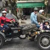 CNN crew explores Hanoi on a sidecar