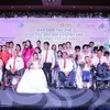 Couples with disabilities tie knot in Hanoi mass wedding