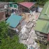 Four houses destroyed by a landslide in Hoa Binh