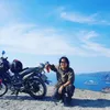 Vietnamese backpacker traveling around the world by motorbike