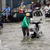High tides flood HCM City streets