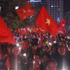 Vietnamese football fans flock to the streets to celebrate Vietnam's football team victory