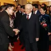 Party, State leader welcomes back overseas Vietnamese for Tet