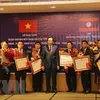 Vietnam, Laos discuss boosting labour, social welfare cooperation