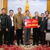 Vietnamese community supports Lao people to overcome flood consequences