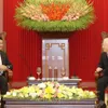 Party, State leader receives visiting Laos PM