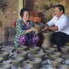 Keeping kiln burning in My Thien pottery village