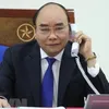 PM Nguyen Xuan Phuc talks on phone with Australian counterpart