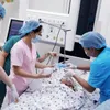 Conjoined twin girls conscious following separation surgery