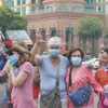 Locals, tourists receives free masks in HCM City