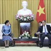 Presidential Offices of Vietnam, Laos enhance ties