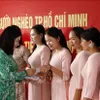 Aid presented to teachers of Lao-Vietnamese bilingual school