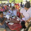 Vietnamese doctors provide free health check-ups for people in Laos