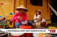 A multilingual sweet soup vendor in Hoi An