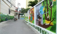 Mural paintings brighten up old houses in Hanoi