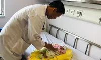 Lao new-born flown to Hanoi for heart operation