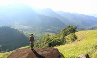 Crossing the stream to admire the Ta Giang grassland