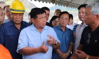 Investment minister inspects projects in southern Laos