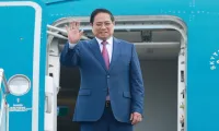 PM Pham Minh Chinh leaves for WEF meeting, working visit to China