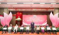 Party, State leader presents Party-membership badges to veteran members
