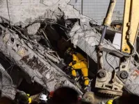 Four Vietnamese trapped under quake-hit Taiwan tower