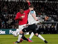 Man United beat Rooney's Derby 3-0 to reach Cup quarters