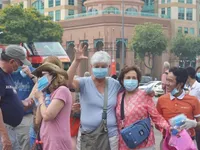 Locals, tourists receives free masks in HCM City