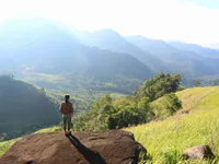 Crossing the stream to admire the Ta Giang grassland