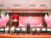 Party, State leader presents Party-membership badges to veteran members