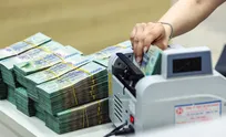 Vietnam orders banks to further cut deposit rates