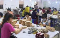 Trung Quốc phá giá đồng Nhân dân tệ: DN da giày, dệt may Việt Nam bình thản