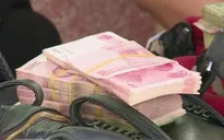 Nhân dân tệ giảm giá: Tác động thế nào tới tiểu thương vùng biên?