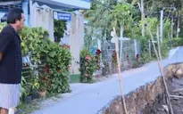 Sạt lở đê bao dọc sông Cái Cao, người dân phải căng dây cảnh báo