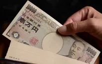 Đồng yen giảm xuống sát mức 157 yen đổi 1 USD