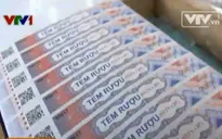 Sau 2 tháng triển khai dán tem rượu, DN gặp khó khăn kép