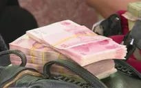 Nhân dân tệ giảm giá: Tác động thế nào tới tiểu thương vùng biên?