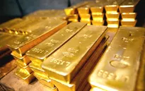 Vàng rời khỏi mức thấp trong 6 năm sau quyết định của FED