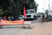 People protest against overloaded quarry trucks