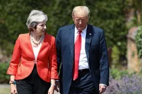 Donald Trump arrives in Britain for first visit as US President