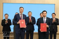 Vietnam exchanges cooperation documents with UN development agencies