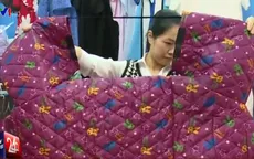 Nguy cơ tai nạn từ những chiếc áo chống rét kỳ lạ tại Hà Nội