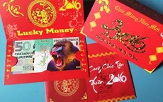 Tiền lì xì hình khỉ “đắt khách” dịp Tết Bính Thân 2016