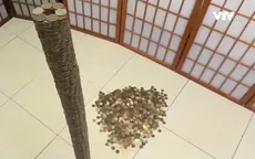 Chàng trai trổ tài xếp gần 3.500 đồng xu thành chồng cao gần 1m