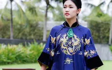 Á hậu Thanh Tú diện áo dài phượng hoàng của NTK Minh Hạnh tại APEC 2017